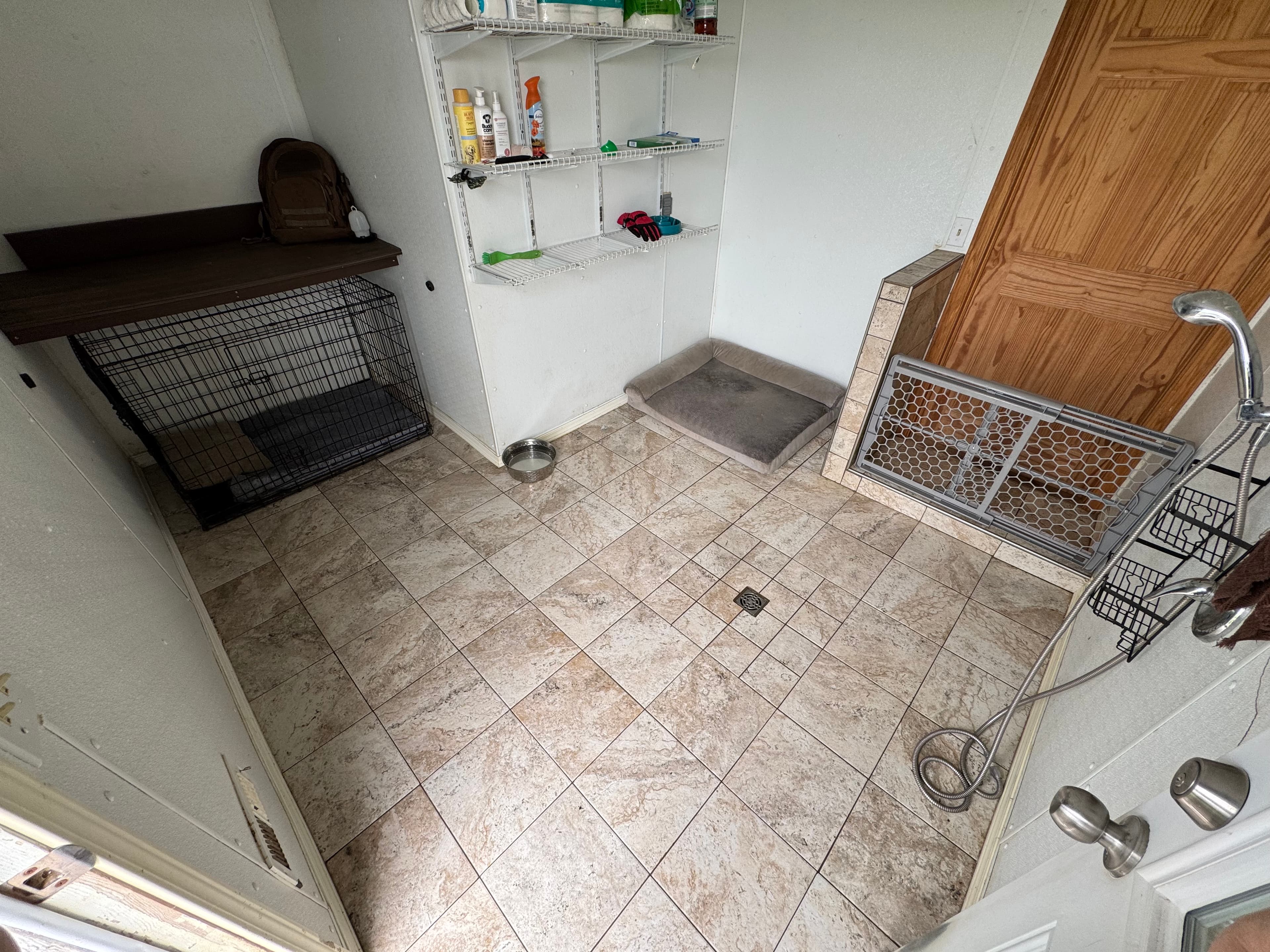 Clean indoor kennel room used for structured boarding and dog care at Patriot K9.